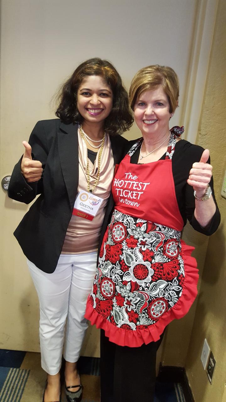 Geetha Krishnan and a fellow attendee giving thumbs up